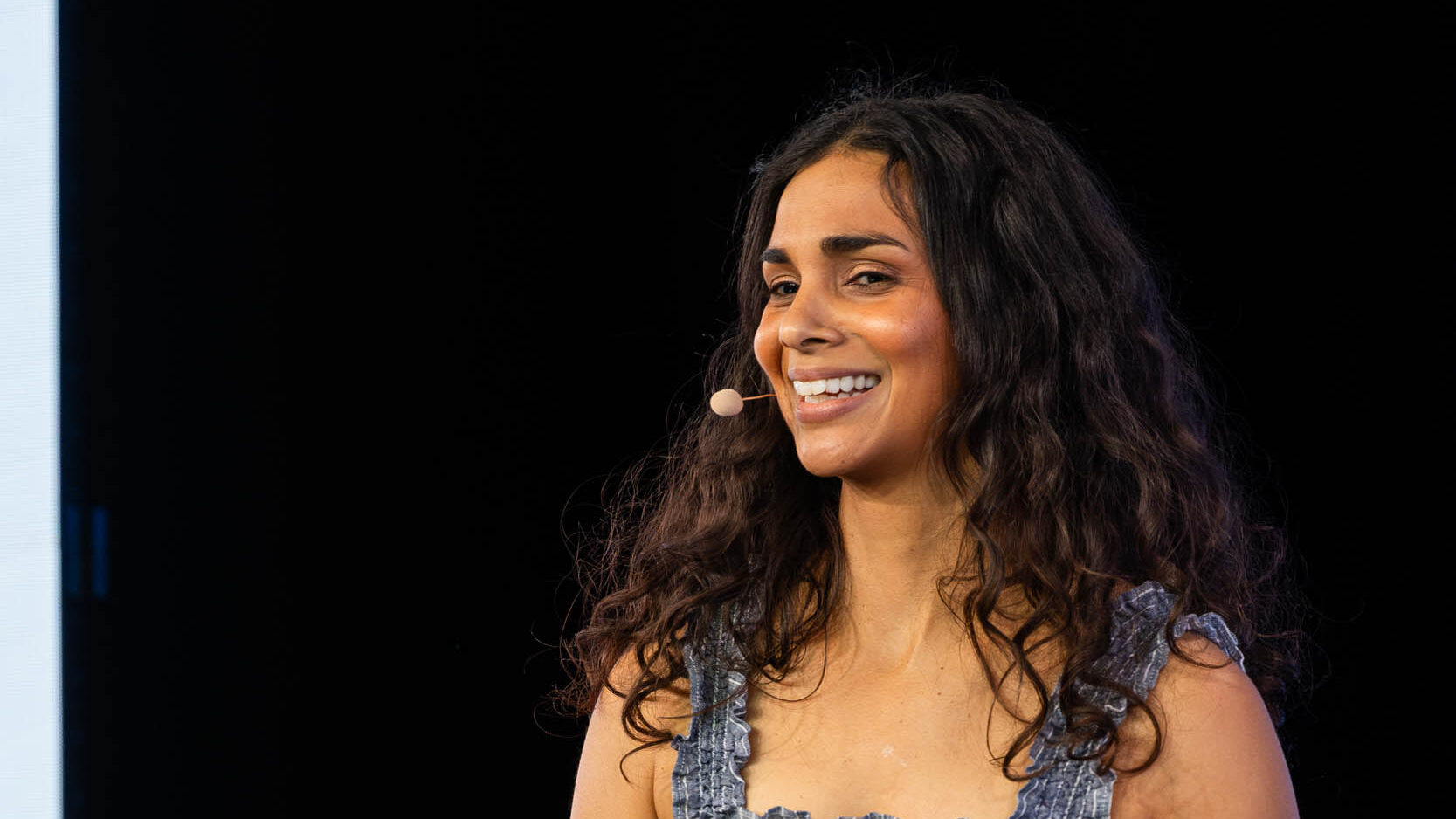 732A5785-Enhanced-NR-web - Showit Nisha Vora speaking to small business owners.