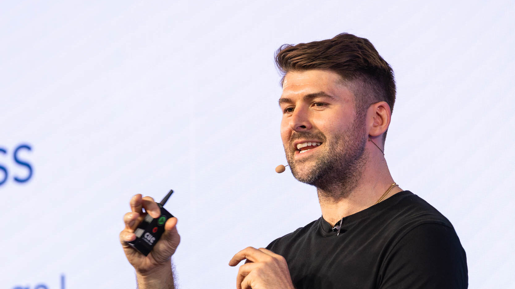 732A6076-Enhanced-NR-web - Showit Chris Donnelly speaking to small business owners.